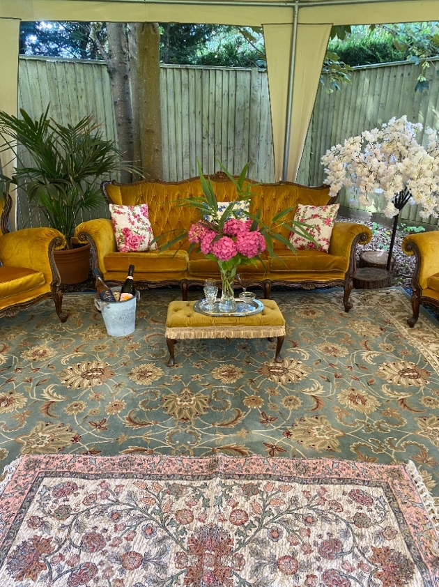 sofa rugs and armchair in gazebo