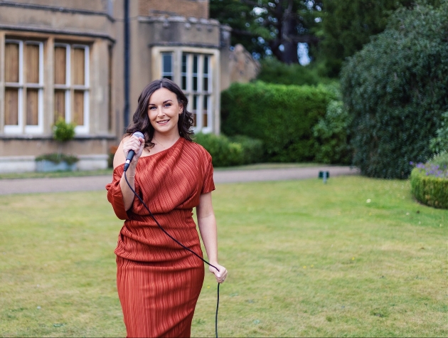 charlotte in red dress singing