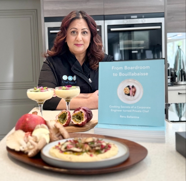 Private chef, Renu Ballantine at kitchen counter with book